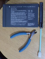 Removing-battery-cap-from-PowerBook-100.jpg